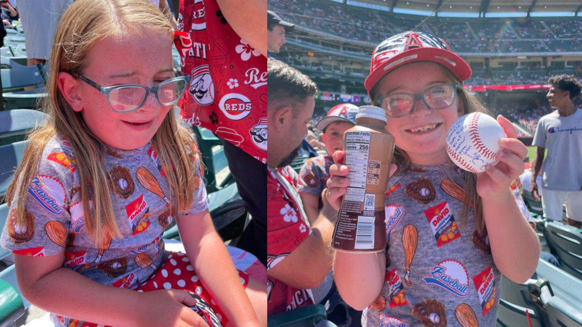 Cincinnati Reds outfielder Jesse Winker distracted by fan's nachos after  making running catch