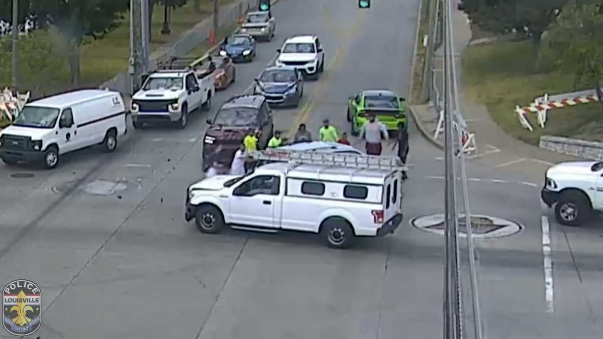 College football players rescue vehicle rolled over near stadium