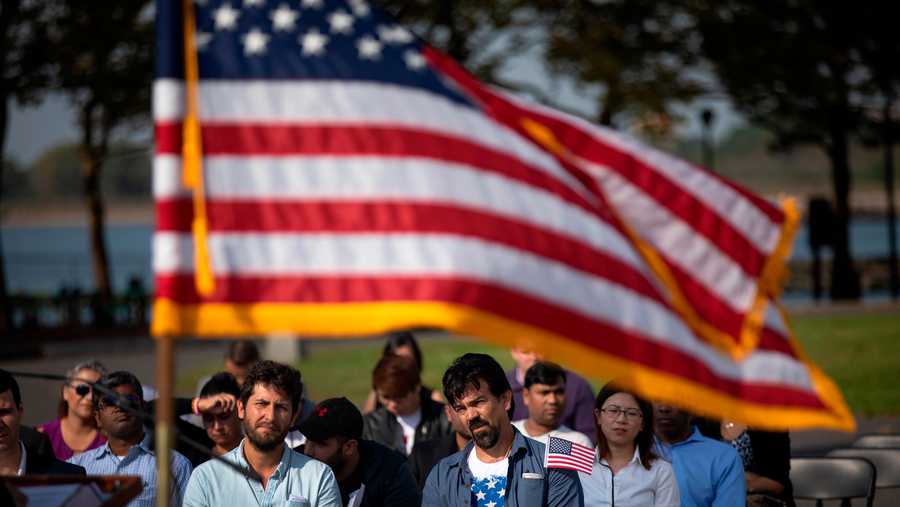 Immigrants wait to take the Oath of Citizenship during a naturalization ceremony at Liberty State Park, October 2, 2018 in Jersey City, New Jersey. 35 new citizens were naturalized at the ceremony hosted by U.S. Citizenship and Immigration Services