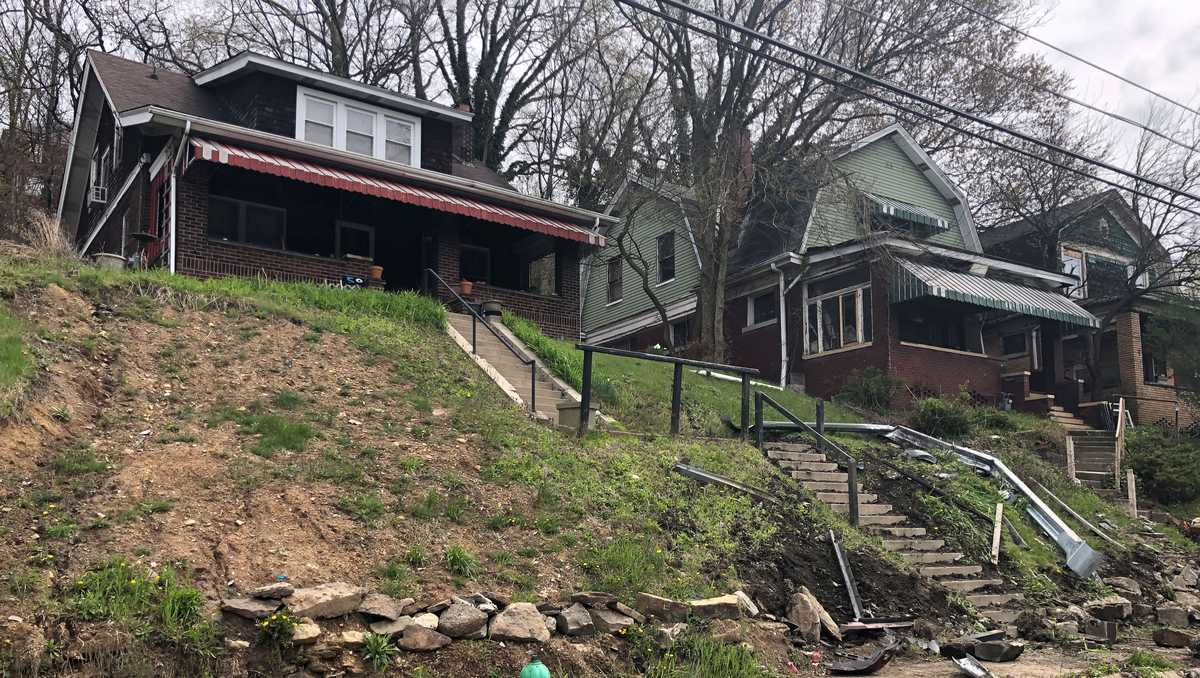 Woman dies after being found unconscious in car over hillside in Pittsburgh
