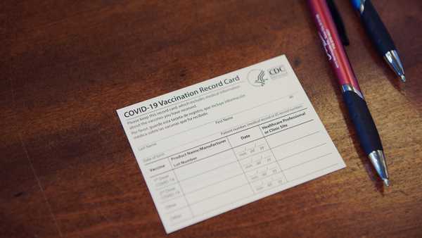 A COVID-19 vaccination record card at the Drilling Pharmacy in Sioux City, Iowa, U.S., on Thursday, March 4, 2021.