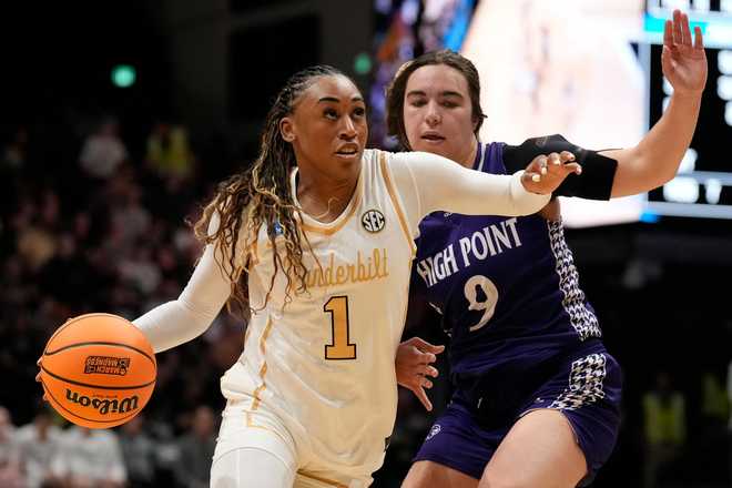 Vanderbilt guard Mikayla Blakes (1) drives the ball past High Point guard Dom Nesland (9) during the first half in the first round of the NCAA college basketball tournament Saturday, March 21, 2026, in Nashville, Tenn.