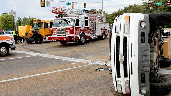 Driver injured in crash involving school bus, SUV