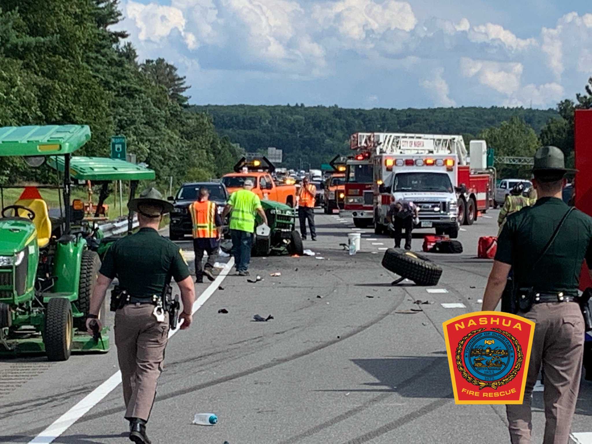 Lawn mower tractor split in two in serious crash on busy highway