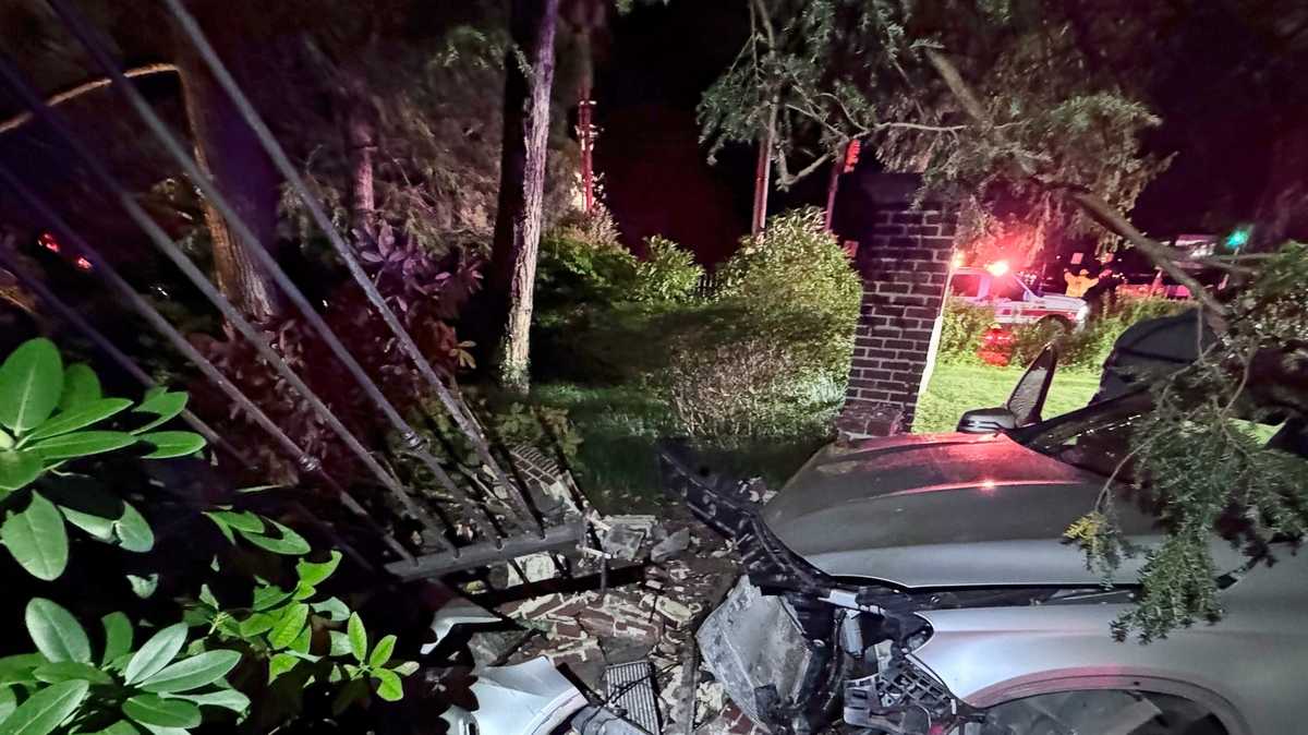 Person taken to hospital after Mercedes smashes through brick wall in ...
