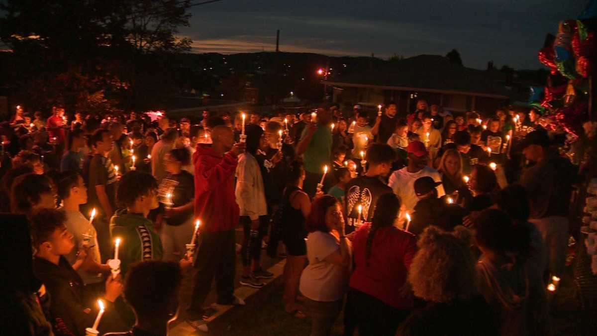 Vigil honors man shot and killed outside football stadium