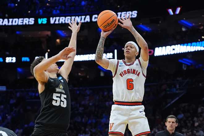 Virginia's Jacari White (6), goes up to shoot against Wright State's Michael Cooper during the first half in the first round of the NCAA college basketball tournament, Friday, March 20, 2026, in Philadelphia.