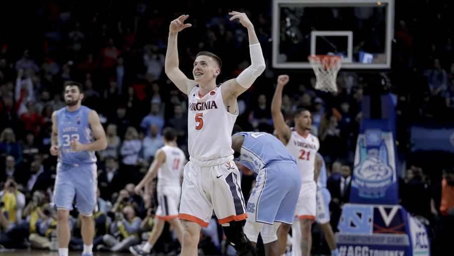 Virginia guard Kyle Guy (5) celebrates as the final seconds wind off the clock against North Carolina in the championship game of an NCAA college basketball game during the Atlantic Coast Conference men's tournament Saturday, March 10, 2018, in New York.