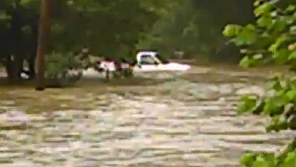 A vehicle became stuck in flood waters in Hopwood, Fayette County.