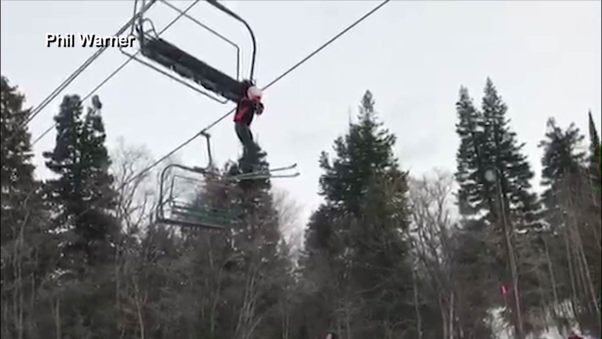 Ski trip rescue Boy stuck dangling from chair lift