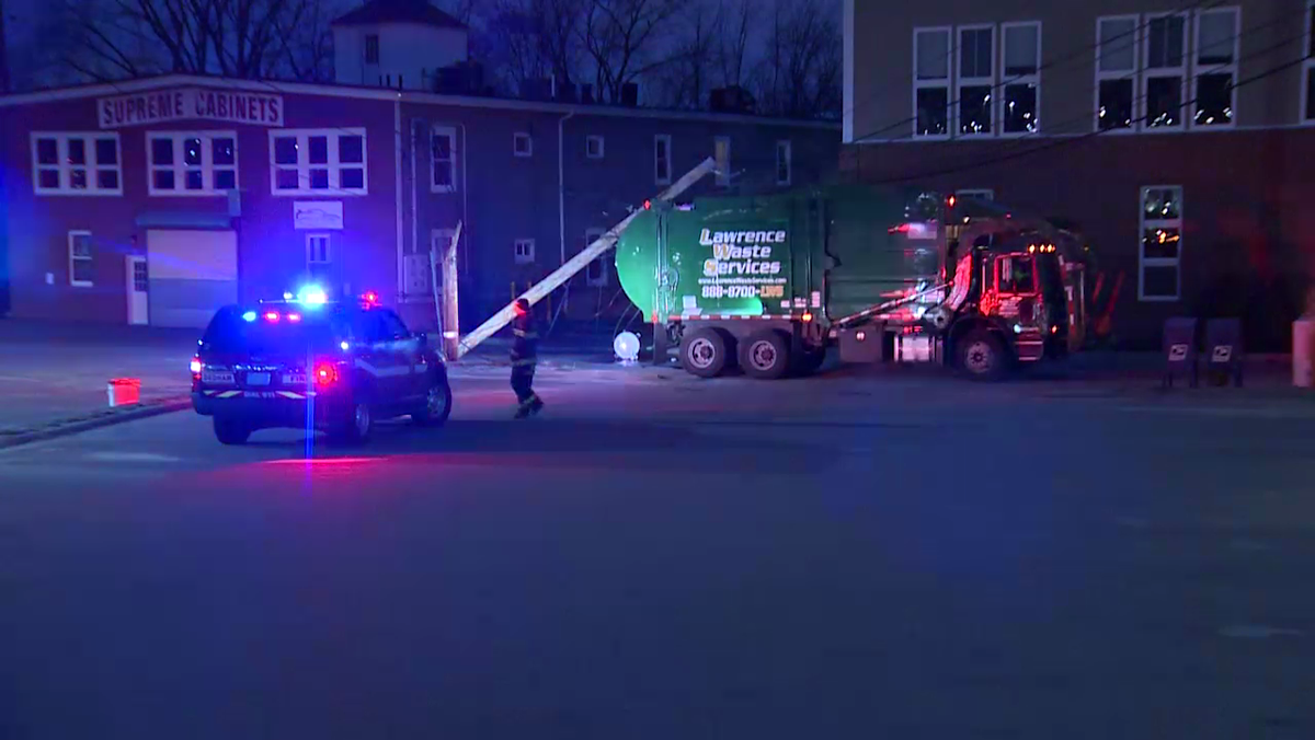 Driver trapped in truck after vehicle hits utility pole