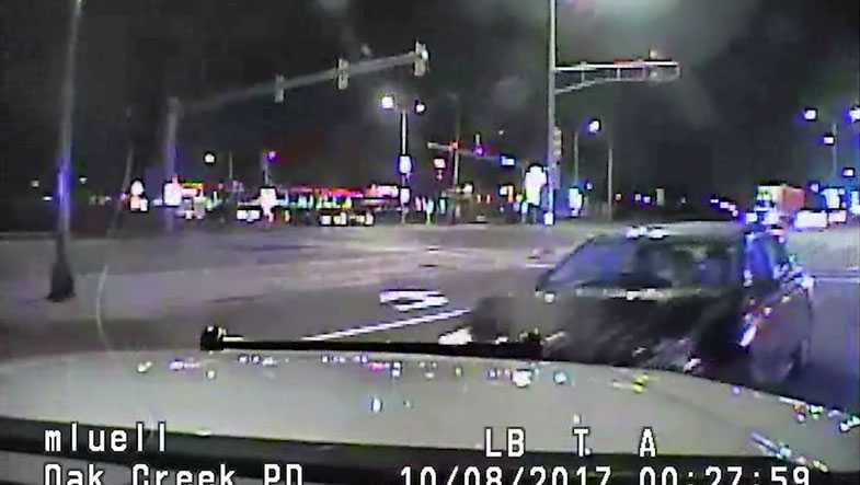 Accused drunken driver with child in car slams into police squad car