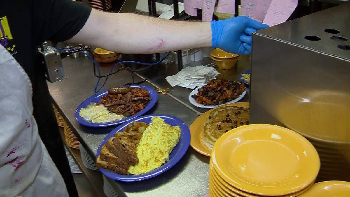 Back up and running: Popular diner reopens after fire