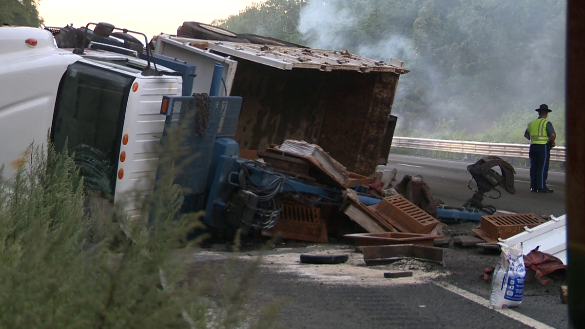 Debris from overturned dump truck on Interstate 495 in Plainville