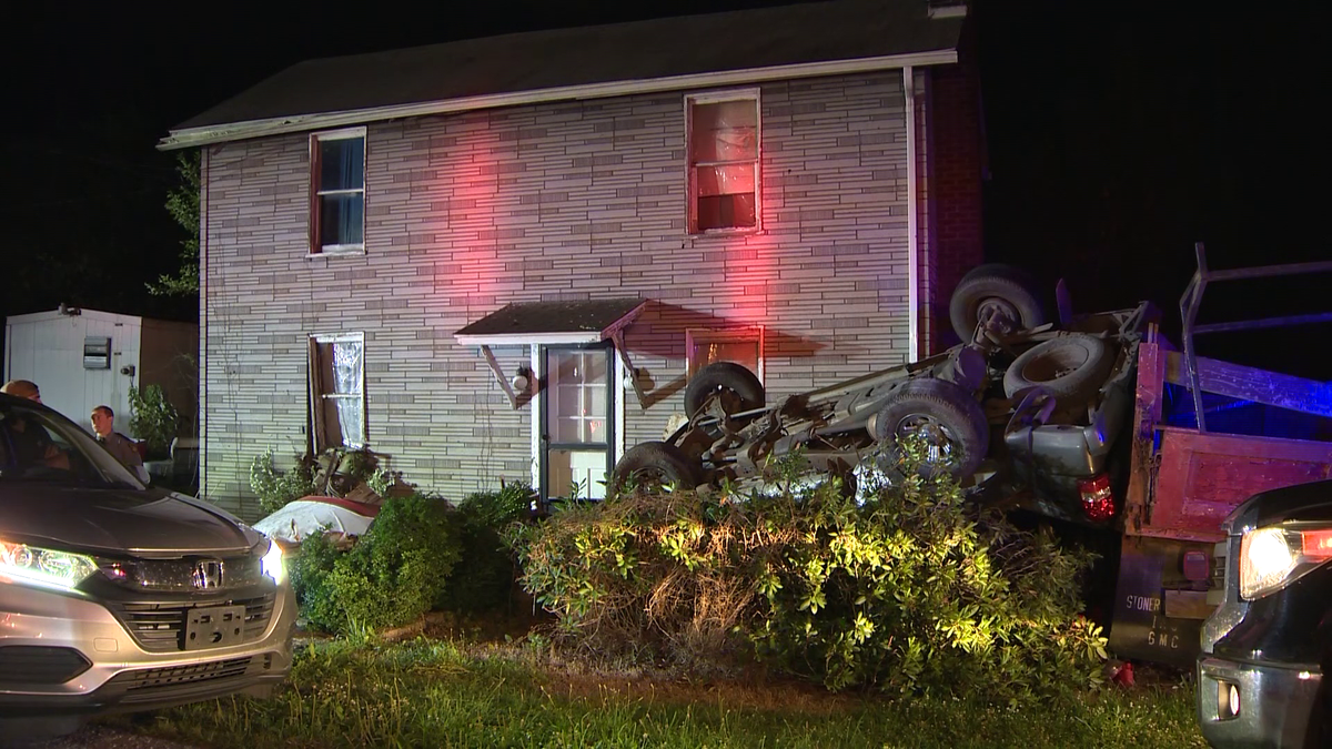 State police investigating after vehicle crashes outside of house in