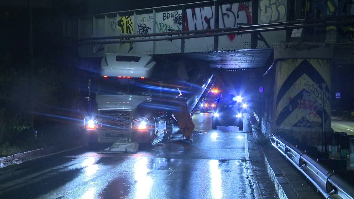 Over height tractortrailer hits bridge on Soldiers Field Road in Boston