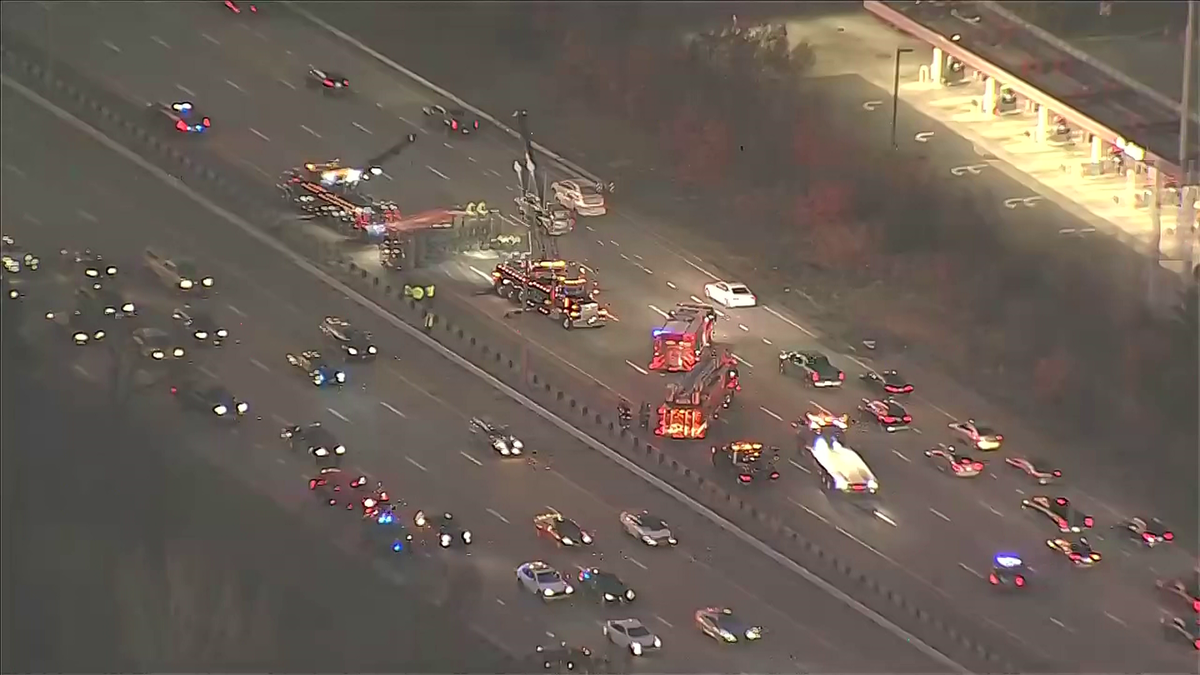 Trash truck rollover snarls commute on Interstate93 in Woburn