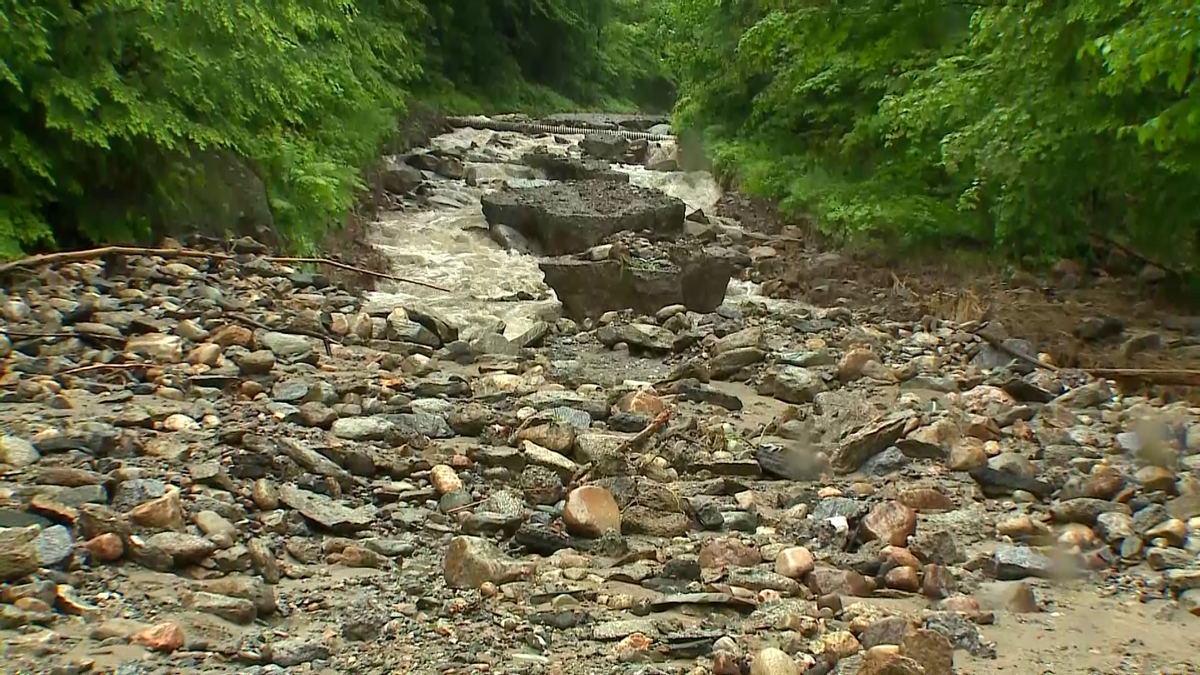 Newport, NH, road washed out after flash flooding from heavy rain