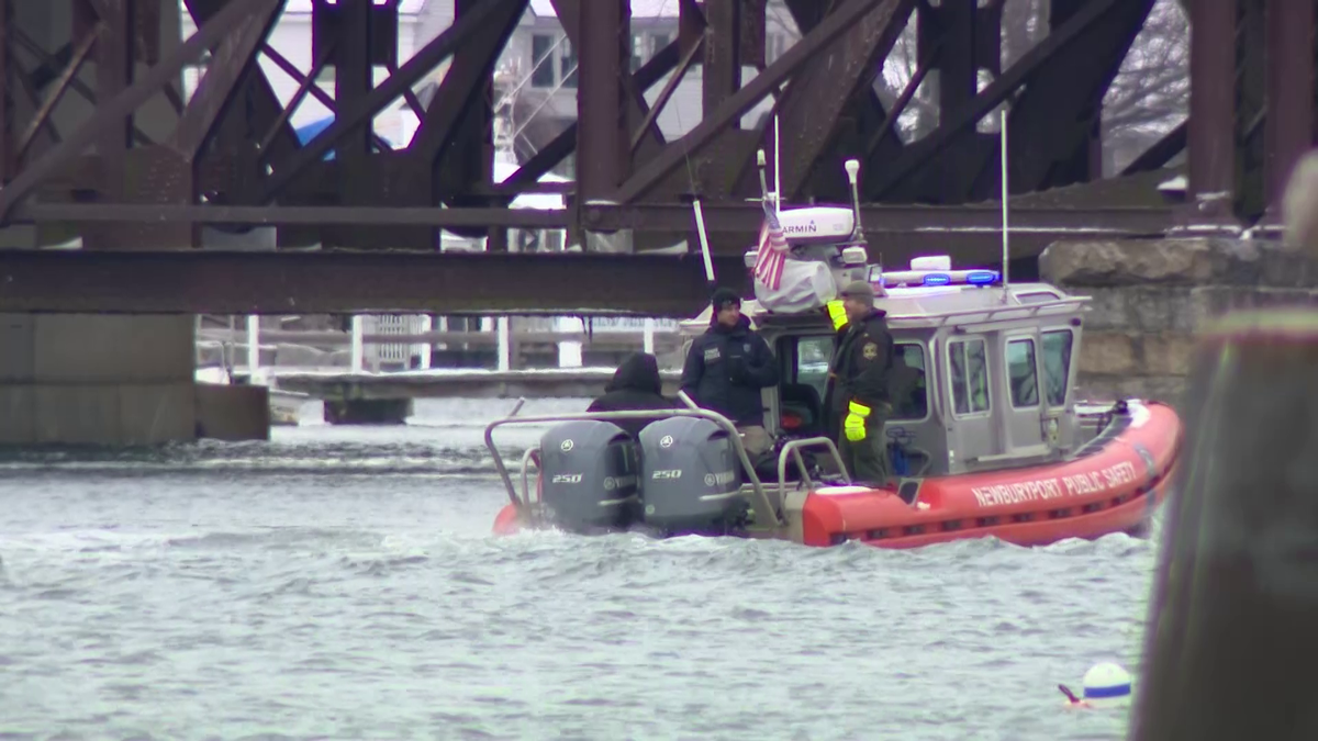 Crews suspend day two of search for man seen clinging to side of boat ...