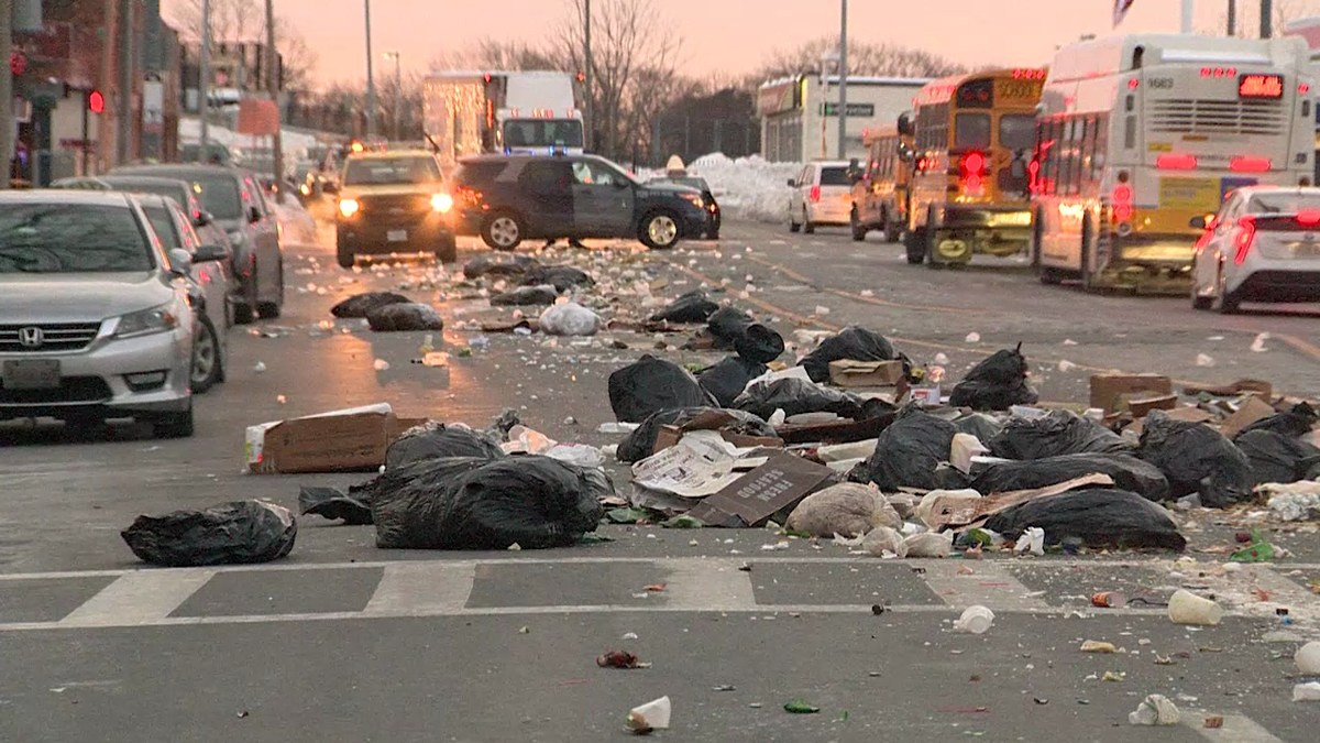 Yuck! Trash truck dumps load all over Boston street