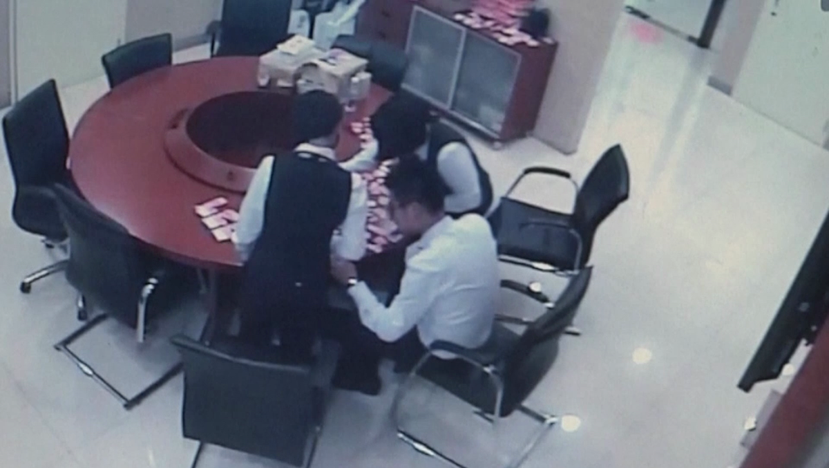 Tellers spend hours taping together money kid shredded