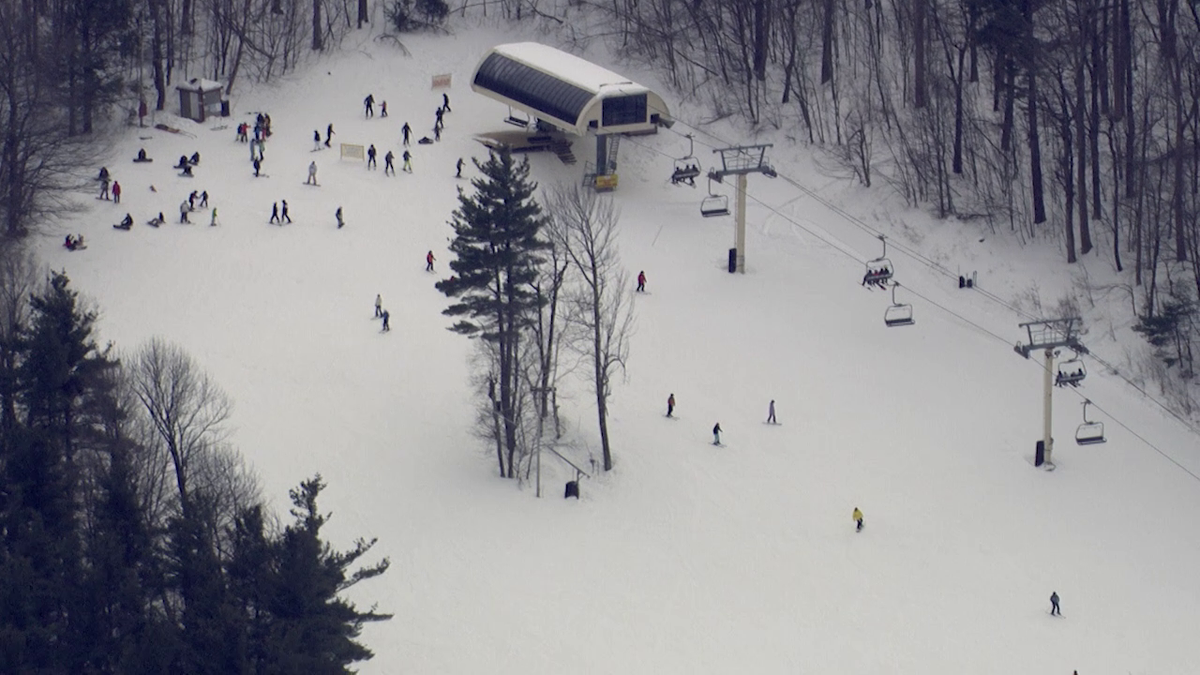 Skiers enjoy natural snow on mountains during February vacation