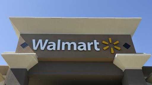 This Sept. 19, 2013, file photo, shows the sign of a Wal-Mart store in San Jose, Calif. 