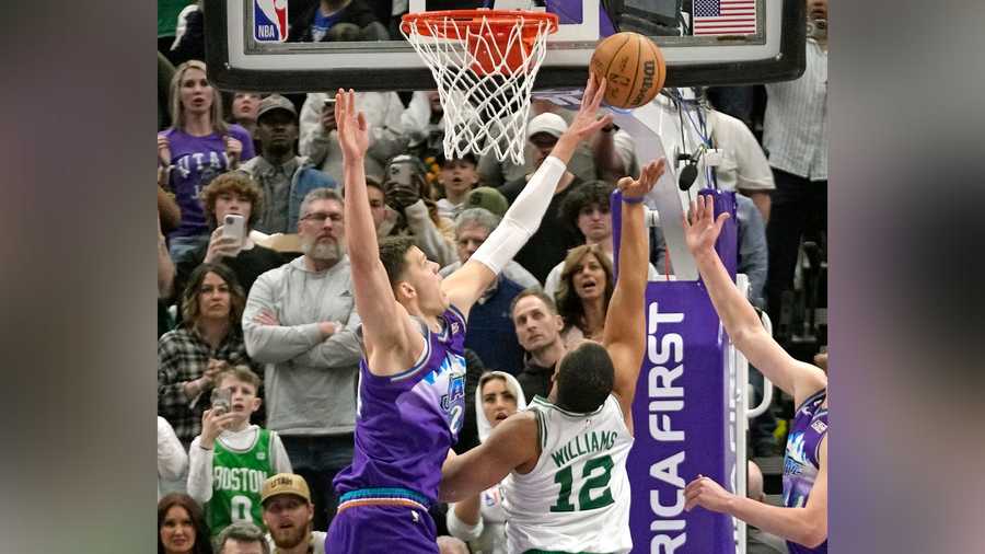 Utah Jazz center Walker Kessler (24) blocks the shot of Boston Celtics forward Grant Williams (12) during the second half of an NBA basketball game, Saturday, March 18, 2023, in Salt Lake City.