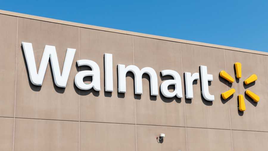 Walmart's logo is shown on the side of a store