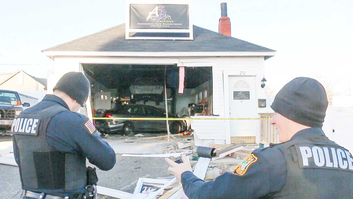 Driver arrested after hit-and-run crash into auto shop, officials say