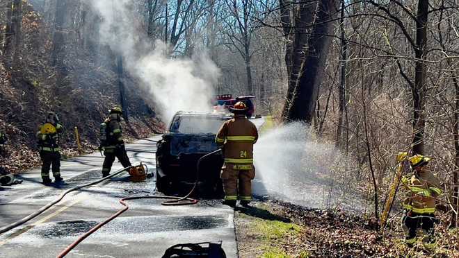 Vehicle, brush fire shuts down road in Lancaster County, Pa.