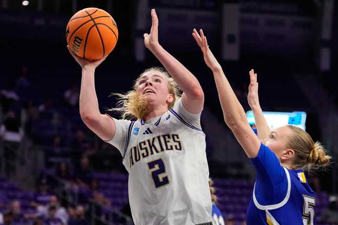 Washington guard Avery Howell (2) shoots as South Dakota State's Ellie Colbeck (5) defends in the first half in the first round of the NCAA college basketball tournament, Friday, March 20, 2026, in Fort Worth, Texas.