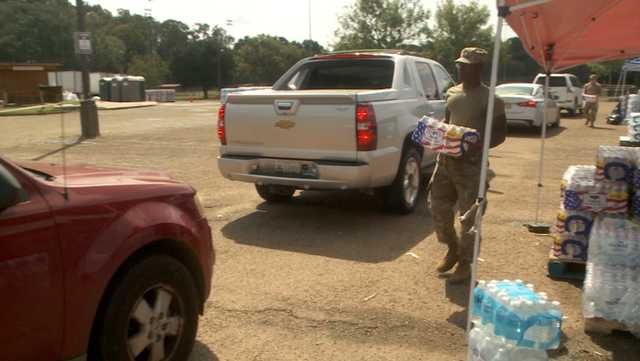 Lines remain steady at water distribution sites even after boil-water alert lifted - Vimarsana News