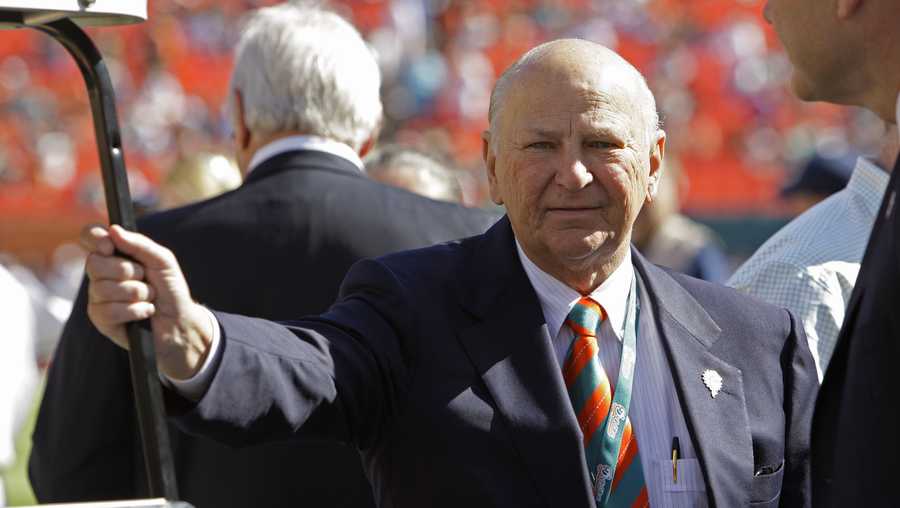 Former Miami Dolphins owner, H. Wayne Huizenga stands on the field before an NFL football between the Miami Dolphins and New York Jets, game Sunday, Jan. 1, 2012, in Miami.