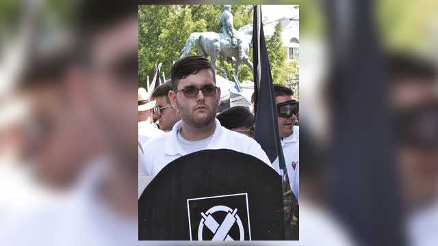 In this Aug. 12, 2017, file photo, James Alex Fields Jr. holds a black shield in Charlottesville, Va., where a white supremacist rally took place. Fields Jr., of Maumee, Ohio, was charged with first-degree murder for allegedly driving his car into a crowd of people protesting against white nationalists. A 32-year-old woman was killed and dozens more were injured.
