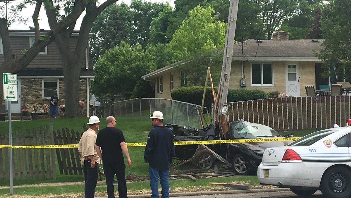 Car crashes into utility pole in West Allis, stranger stops to help