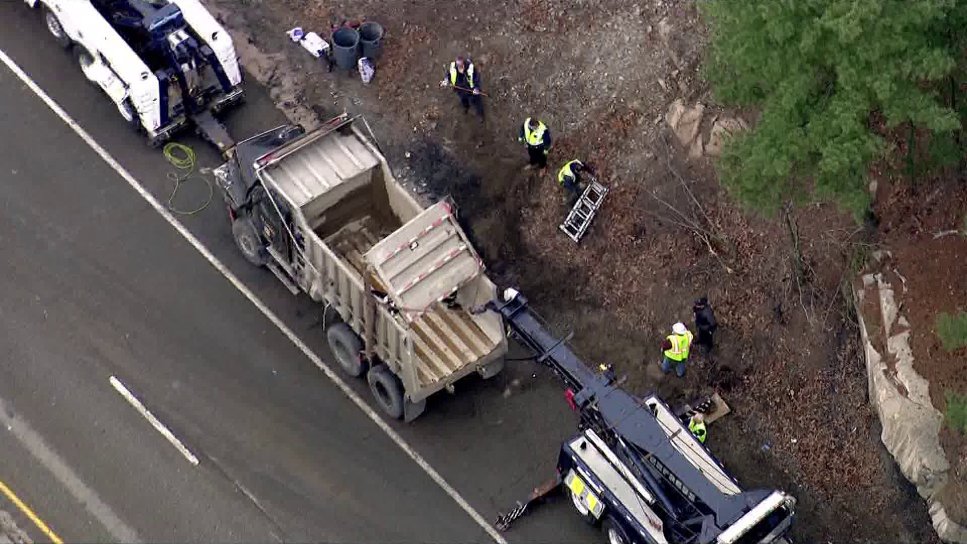 Dump truck rolls over on Mass. highway spilling load onto roadway - Vimarsana News