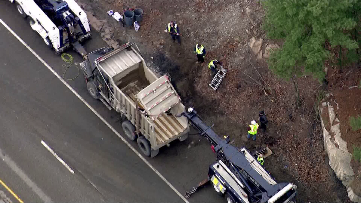 Dump truck rolls over on Mass. highway spilling load onto roadway – WCVB Boston