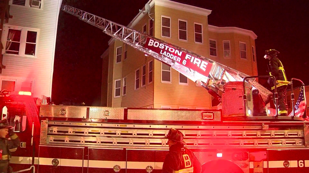 Woman rescued from 2nd floor of burning home in Boston
