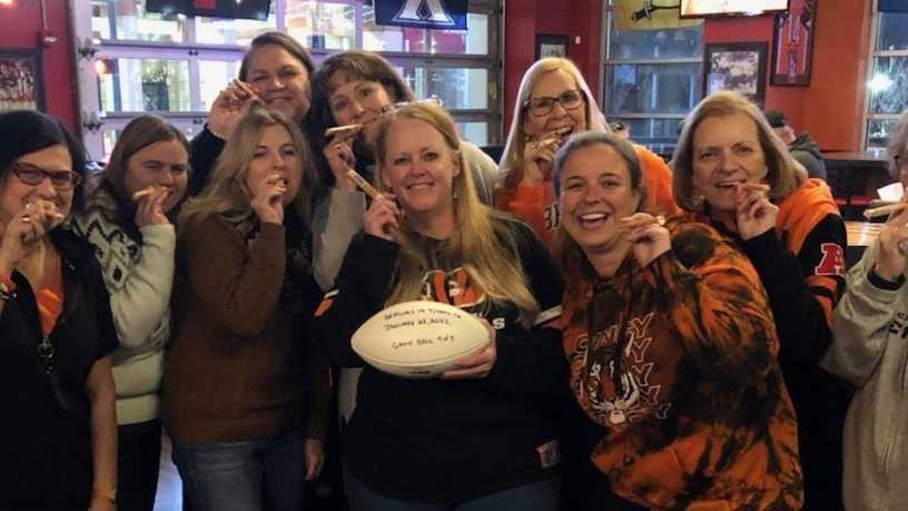 Fans of Mrs. Davis: Flat Rock staff wears colors of the Bengals in