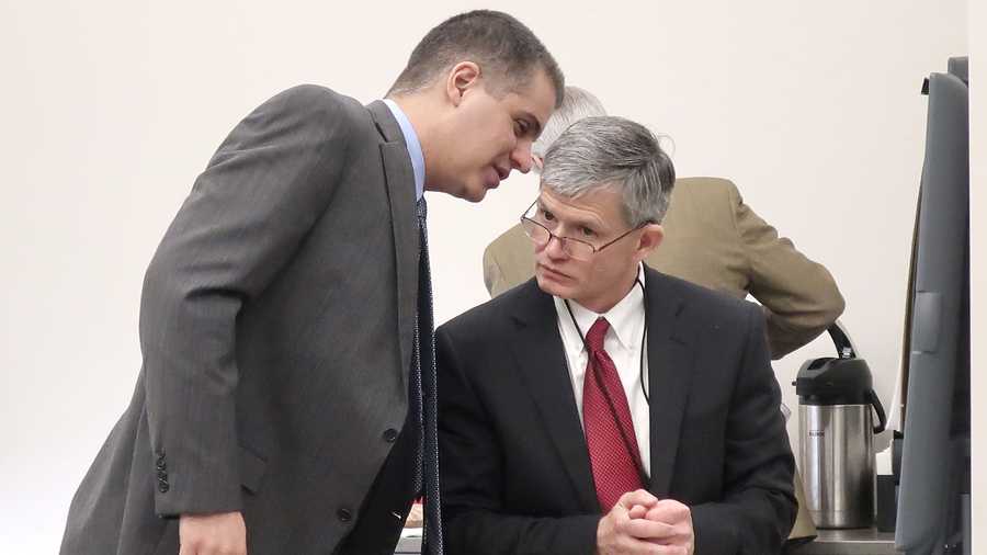 FILE - In this Dec. 12, 2019 file photo, Montgomery County Judge F. William Cullins, right, of Montgomery County, Kansas, confers with his attorney, Christopher Joseph, during a break in his disciplinary hearing in Topeka, Kansas. Cullins, who cursed at courthouse employees so often that a trial clerk kept a “swear journal” documenting his obscene outbursts, should be publicly censured and receive professional coaching, but his removal from the bench is not warranted, a disciplinary panel recommended Friday, Feb. 26, 2021.  (AP Photo/John Hanna, File)