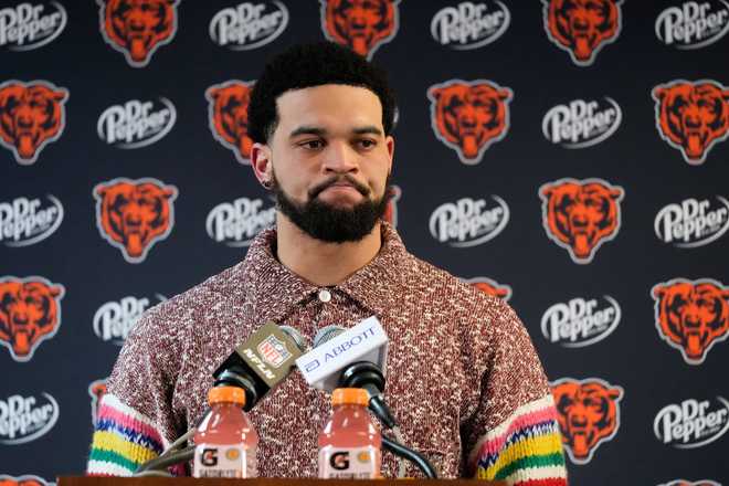 Chicago Bears quarterback Caleb Williams talks to reporters following his team's overtime loss to the Los Angeles Rams during an NFL football divisional playoff game Sunday, Jan. 18, 2026, in Chicago.