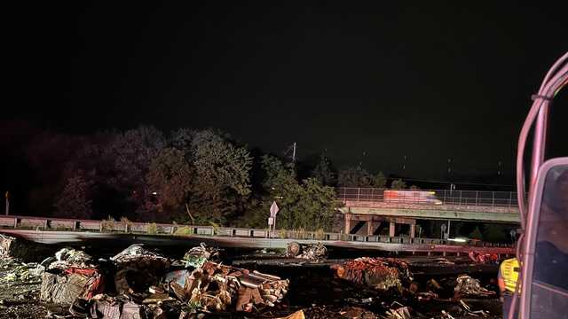 Overturned tractor-trailer causes major delays on Interstate 93