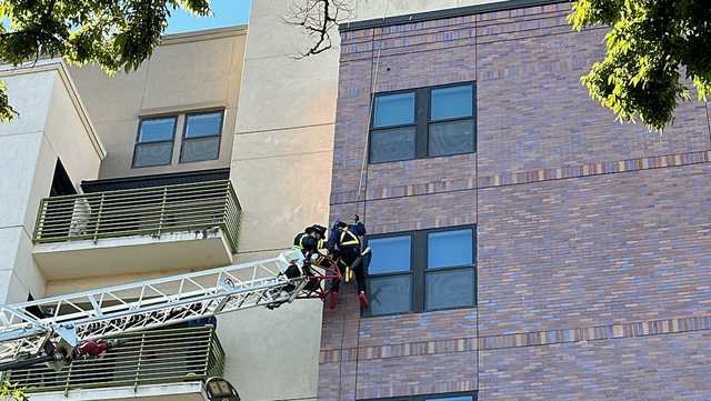Watch: Stuck window washer rescued in Sacramento - Vimarsana News