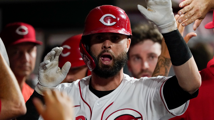 cincinnati reds' jesse winker celebrates with teammates after hitting a three-run home run during the eighth inning of the team's baseball game against the pittsburgh pirates in cincinnati on saturday, aug. 7, 2021. (ap photo/jeff dean)