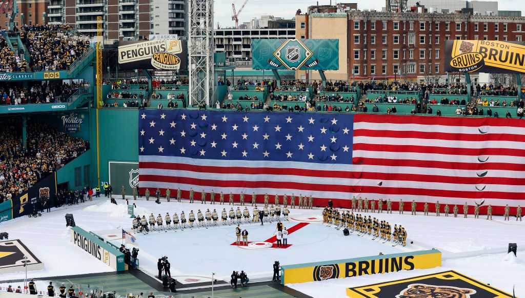 Bruins players wear vintage Red Sox uniforms before Winter Classic