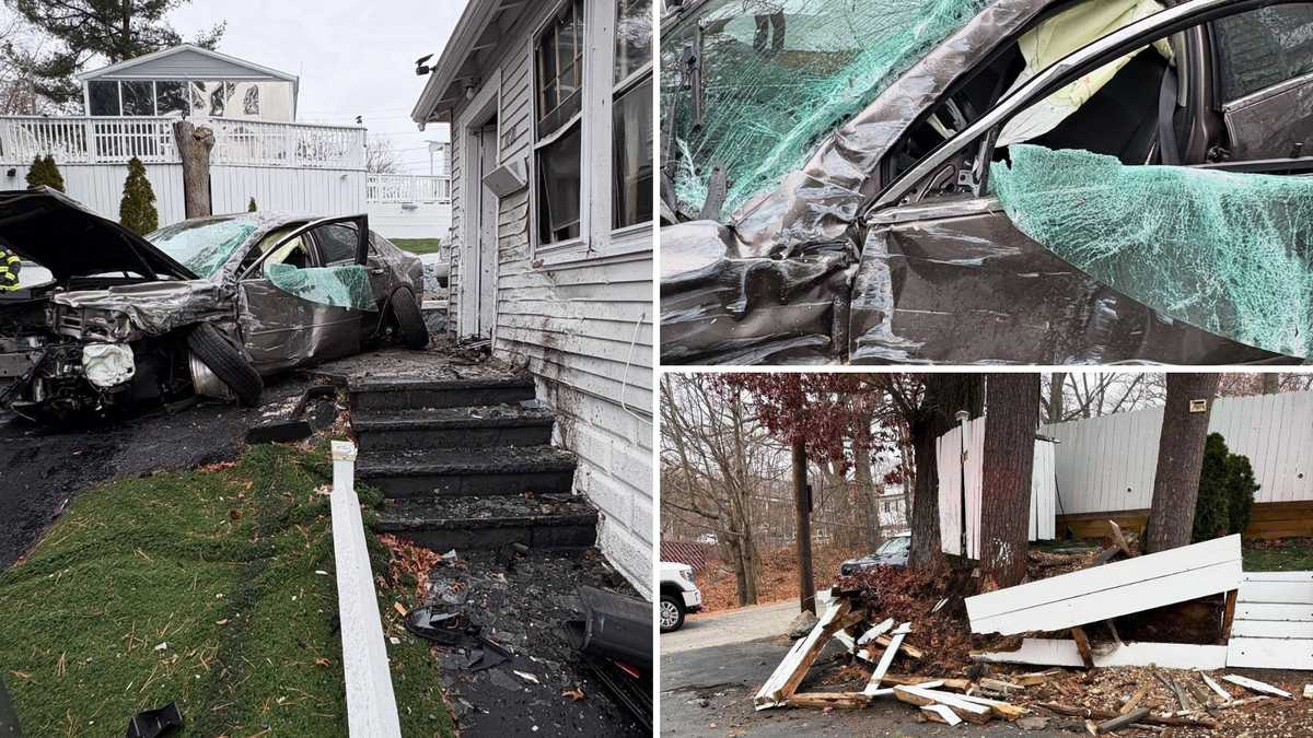 Driver trapped after crash into Massachusetts home