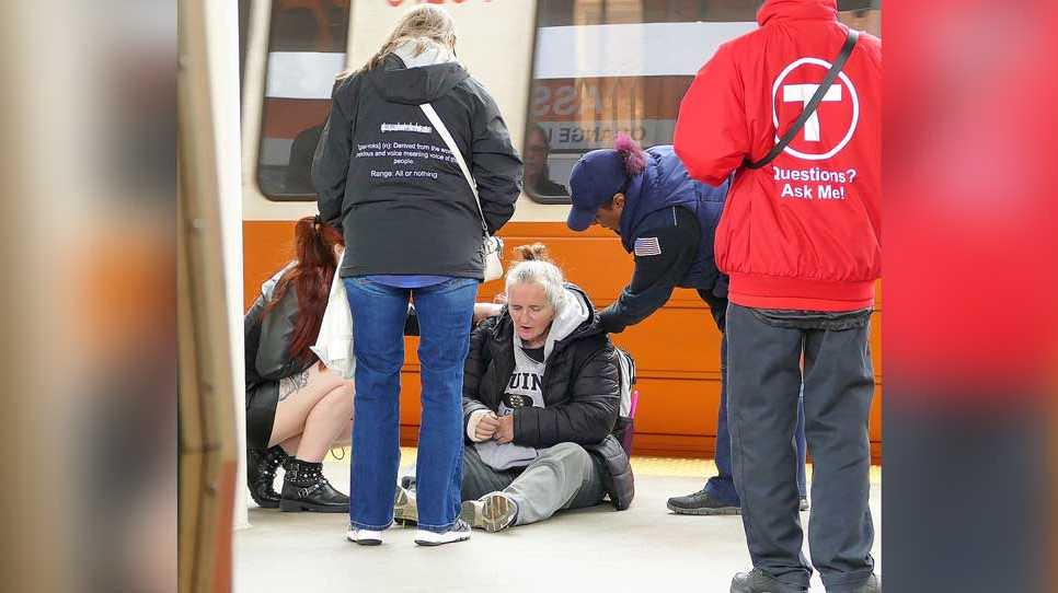 Woman falls down onto MBTA train tracks in Somerville, rescued by group