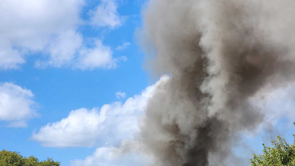 Commercial fire closes roadway near Caroline station