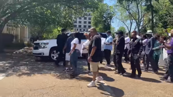 Dozens of protesters march through downtown Jackson ...